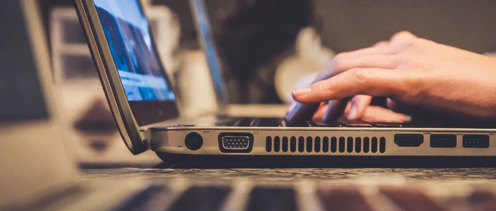 person typing on laptop
