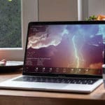 severe storm weather report laptop rainy windows