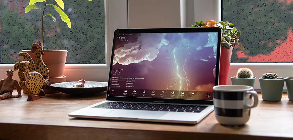 severe storm weather report laptop rainy windows